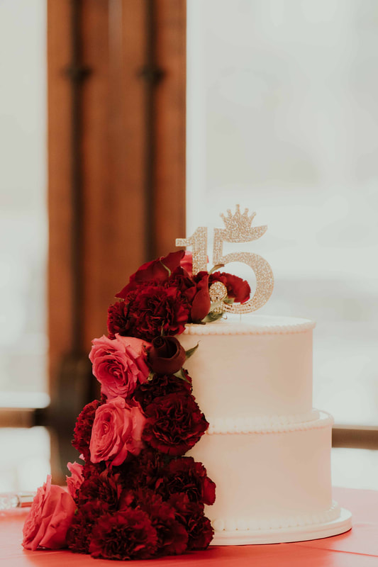 Quinceañera cake with red roses and carnations