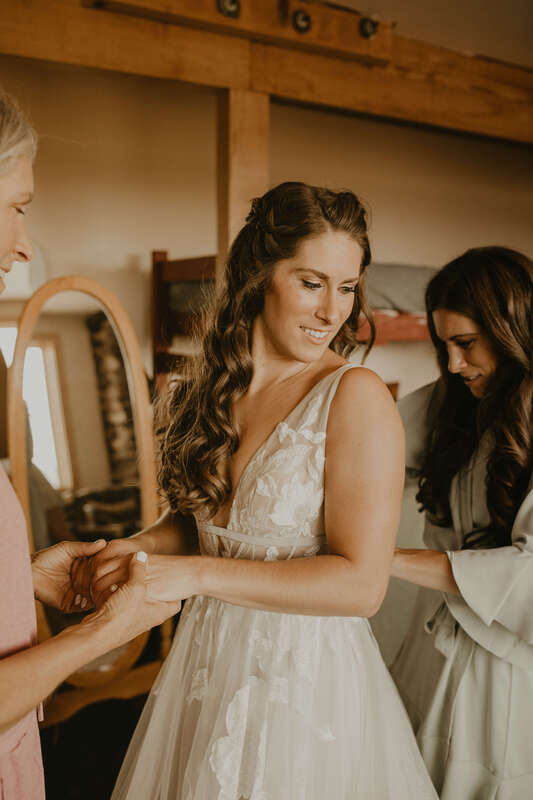 Bride getting ready for her wedding at Colorado Mountain Ranch