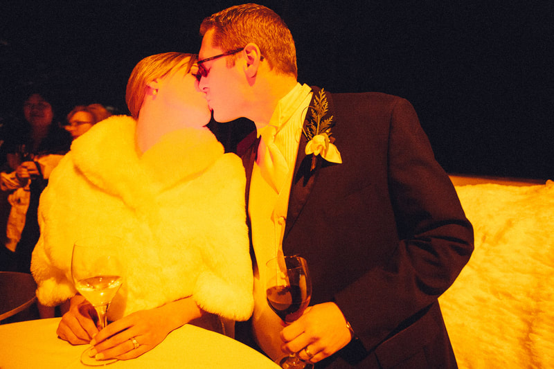 bride and groom kissing at night outdoors