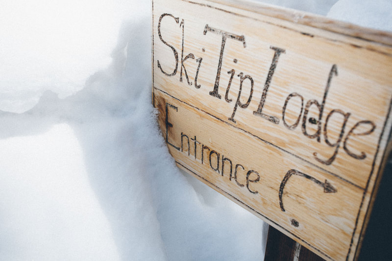 Ski Tip Lodge wooden entrance sign
