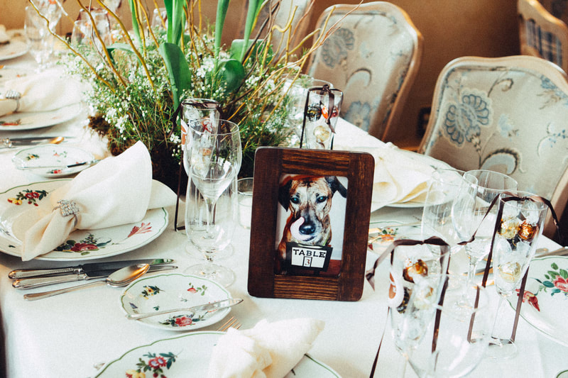 wedding reception table setting and photo table number