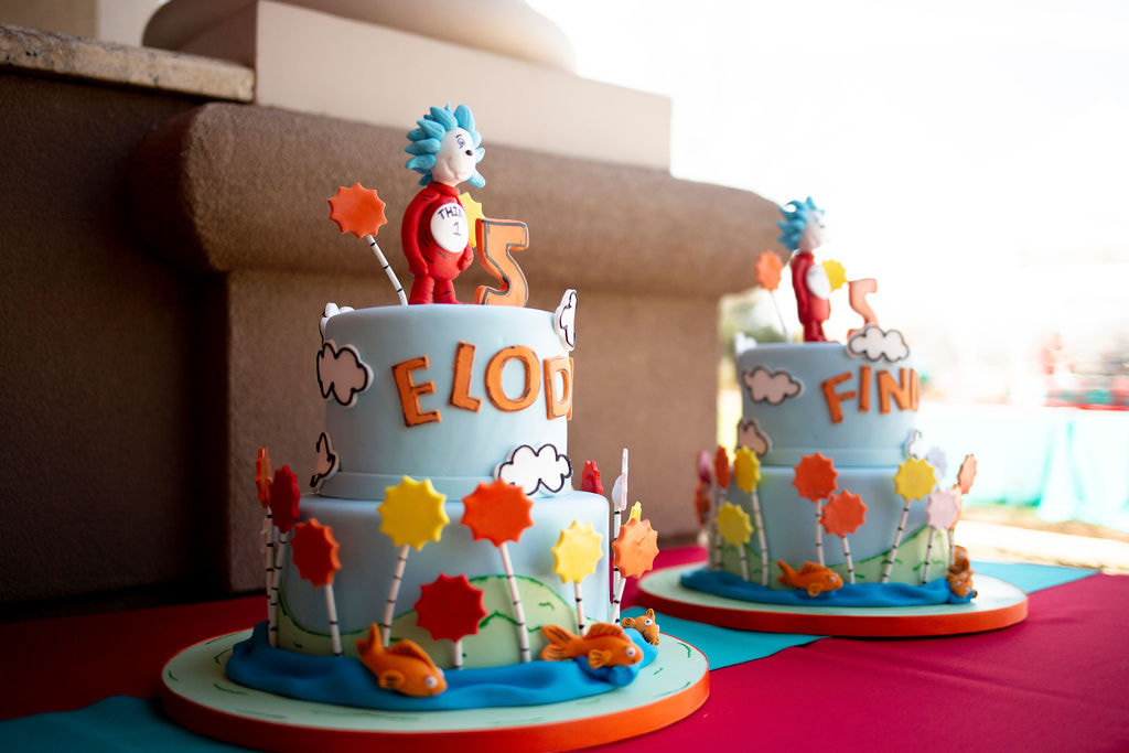 Two individual, two tiered Thing 1 and Thing 2 themed birthday cakes