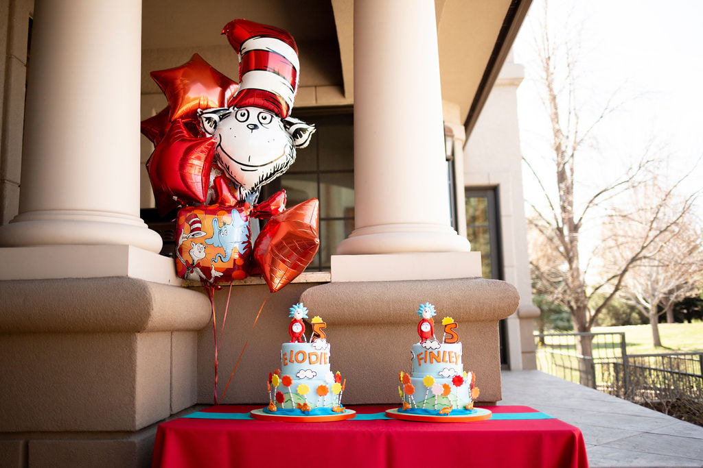 Individual, two tiered Thing 1 and Thing 2 themed birthday cakes with balloon bouquet