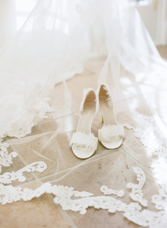 Feather bridal heels on a brocade lace wedding veil