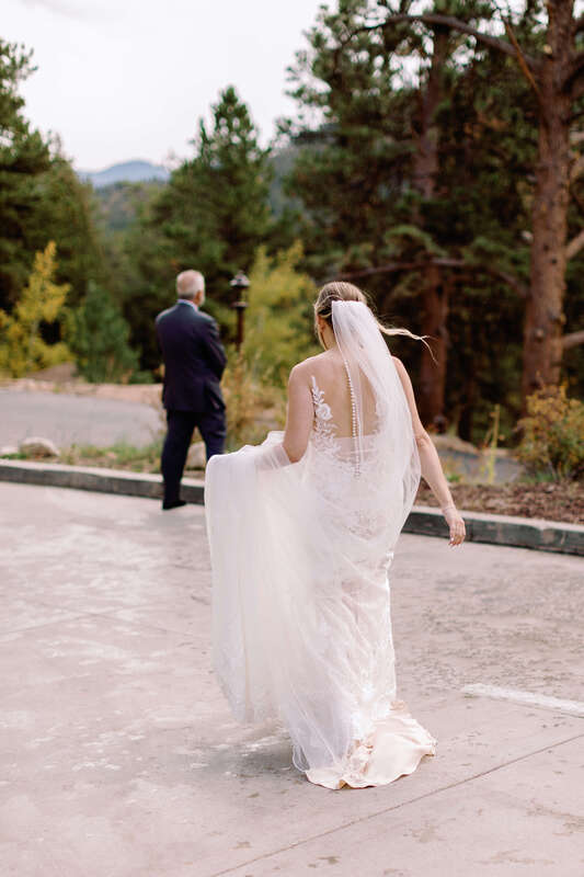 Bride walking to her father for their first look.