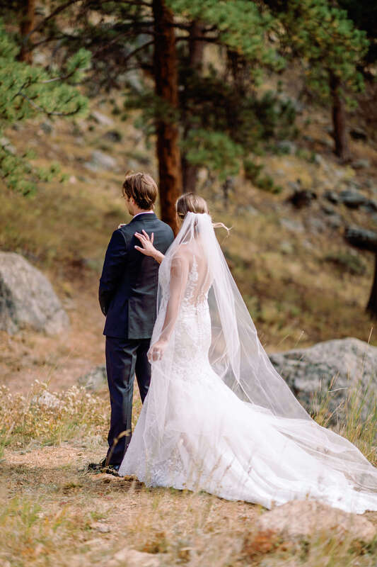 Bride and groom first look in Estes Park, Colorado. 