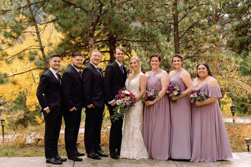Bridal party portraits with bridesmaids in dusty purple gowns.