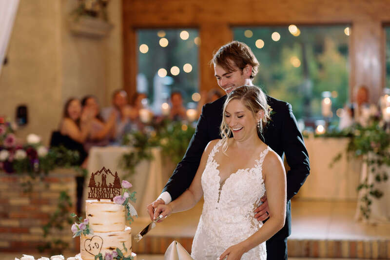 Couple cutting their wedding cake.