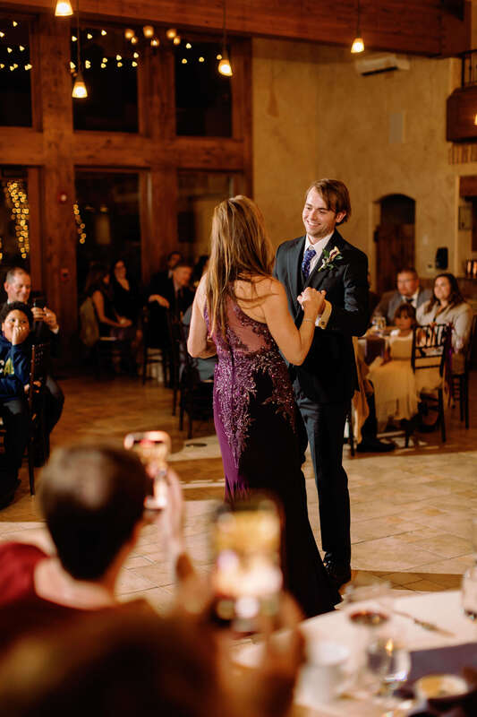 Groom dancing with his mom at a wedding reception