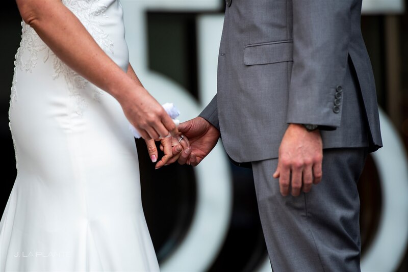 groom holding brides hand after grooms first look at the bride