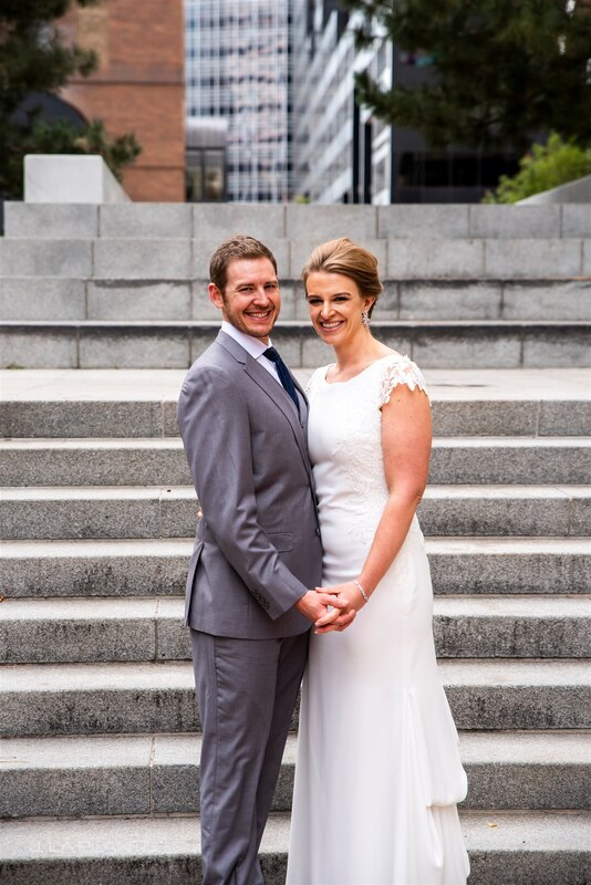 downtown denver wedding couple in front of concrete steps