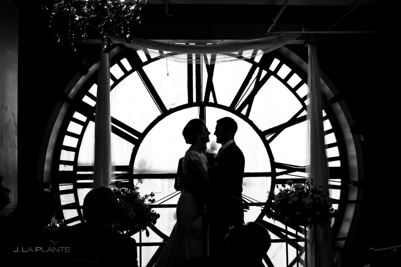 black and white photo of bride and groom at their wedding altar at the Clocktower downtown