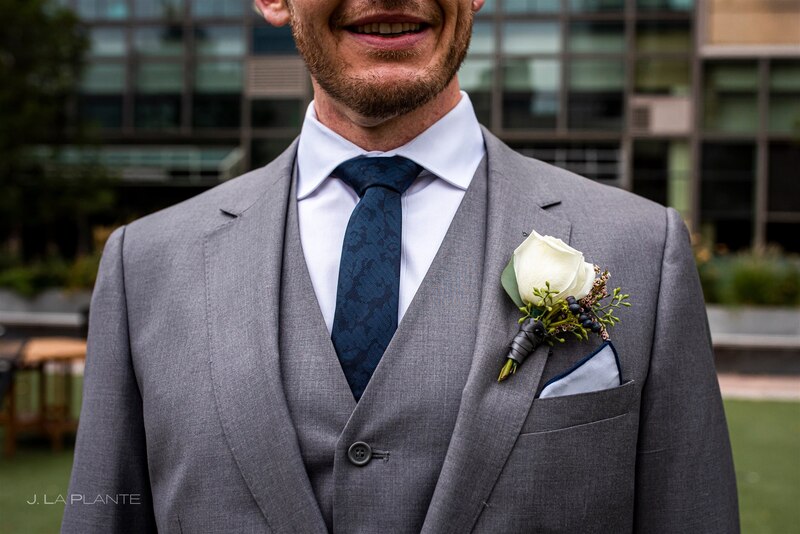 downtown denver wedding groom in suit, tie and white rose boutonniere