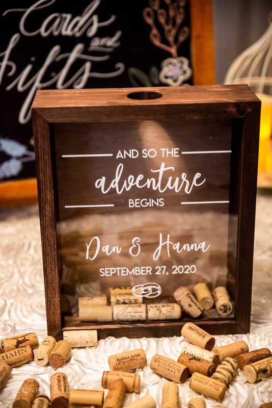 and so the adventure begins with the downtown denver wedding couple's name and wedding date with wine corks for guests to sign as the wedding guest book