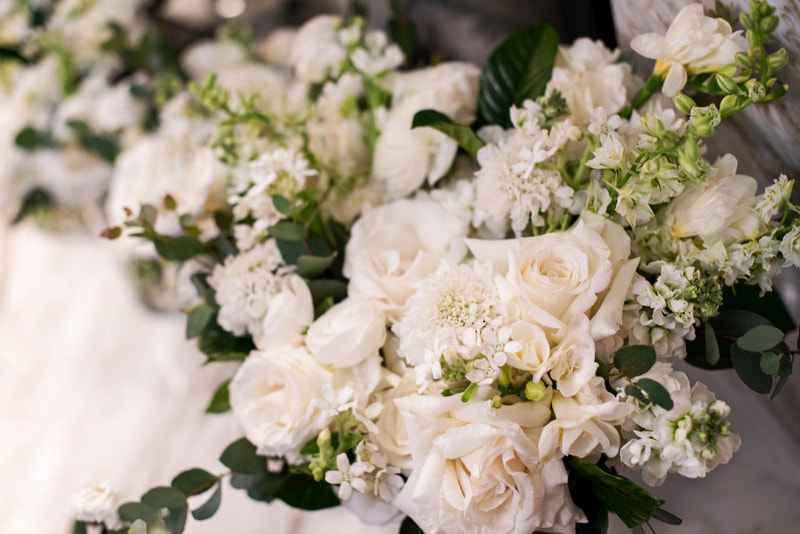 Bridal bouquet filled with white roses and dahlias by Southern Charm