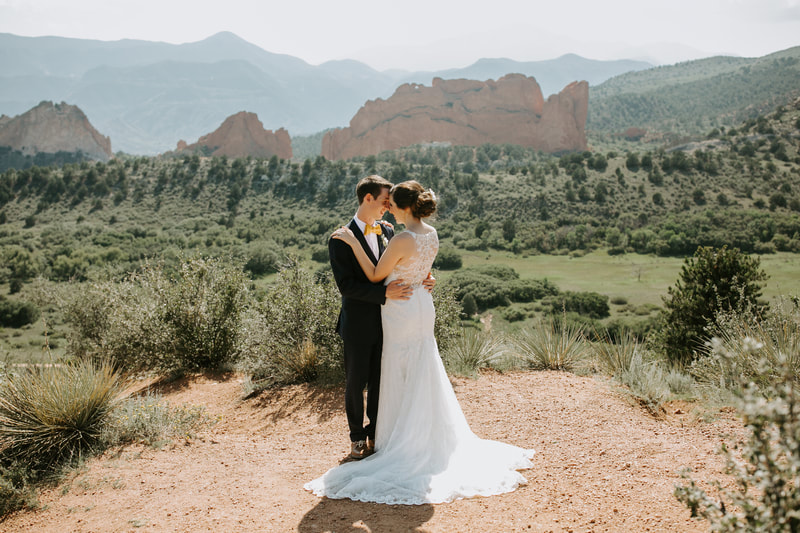 Colorado Springs Wedding Bride and Groom Embrace, Bride and Groom Outdoors Embrace, Bride and Groom with Mountains Embrace
