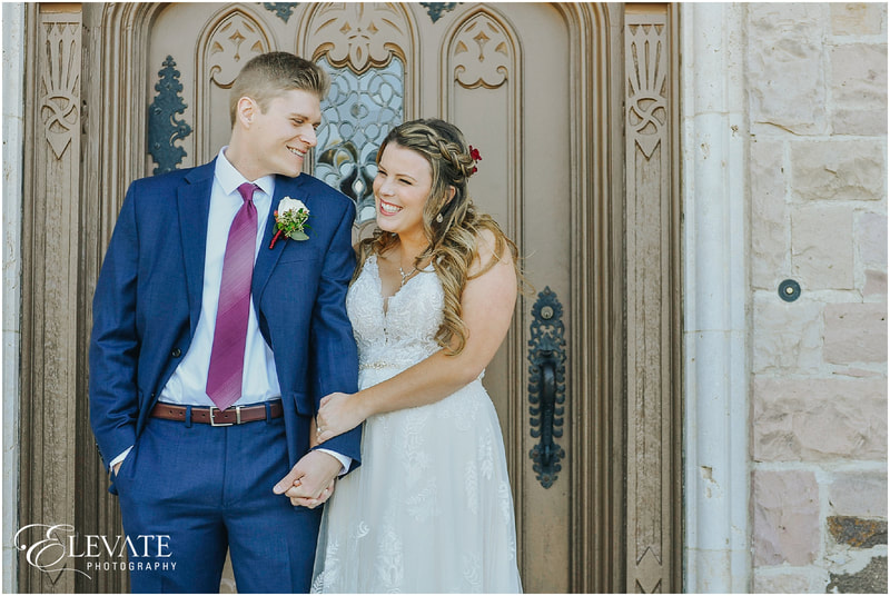 happy bride and groom with an elegant front door backdrop
