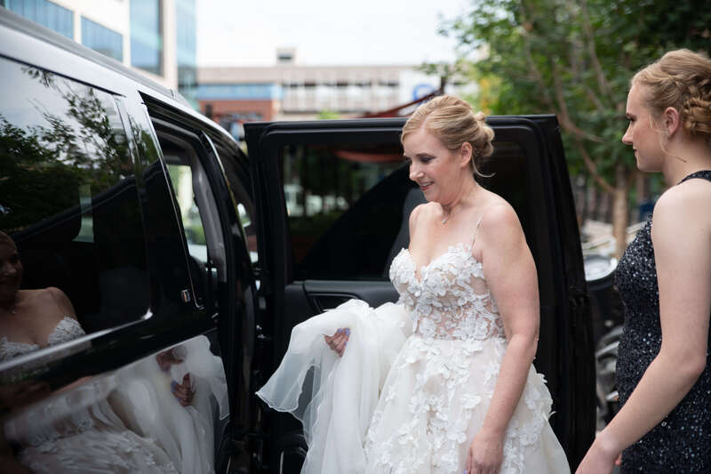 Bride getting into a limo to go to her wedding at Space Gallery
