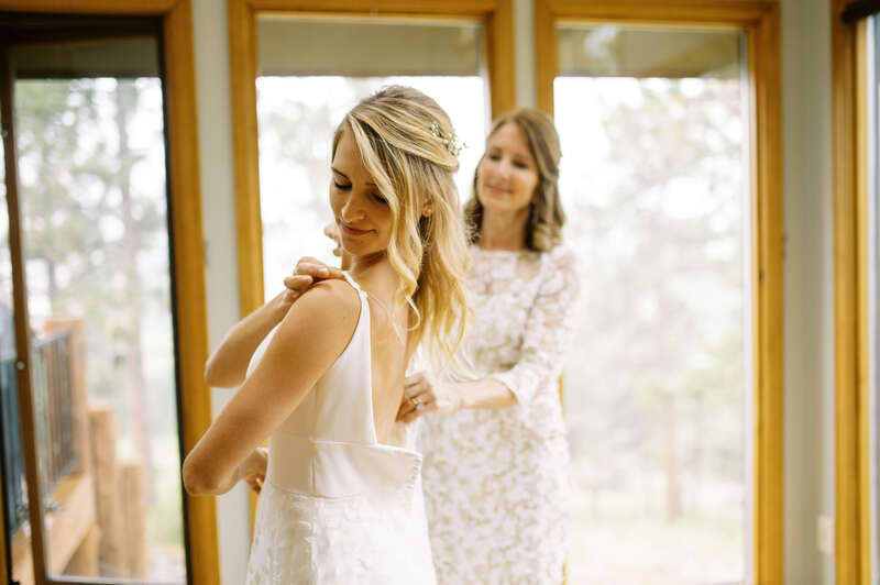 Bride getting ready for her wedding at Wild Basin Lodge