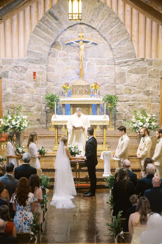 Wedding ceremony at Our Lady of the Mountains Catholic Church in Estes Park, CO