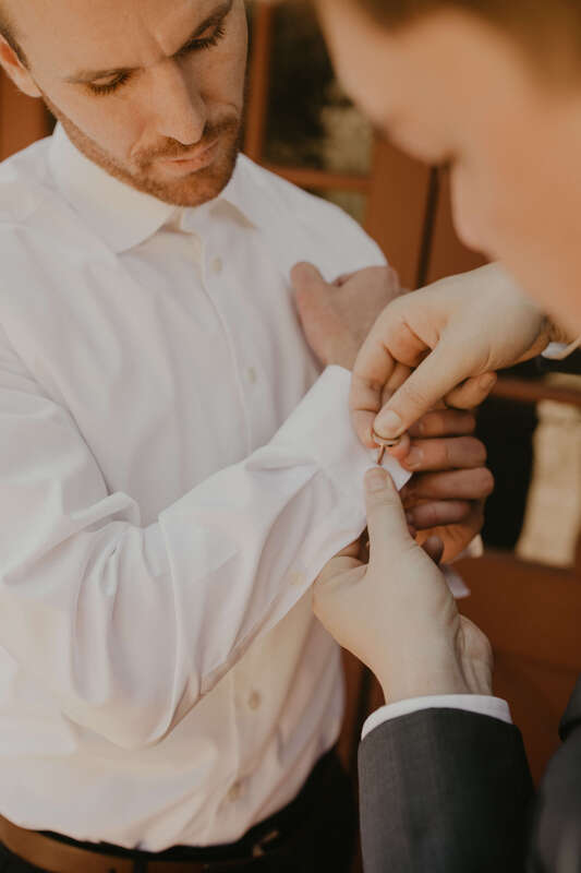 Groom getting ready for his wedding at Colorado Mountain Ranch
