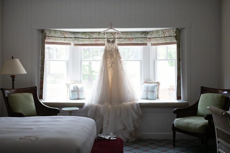 Bridal Gown hanging in bay window